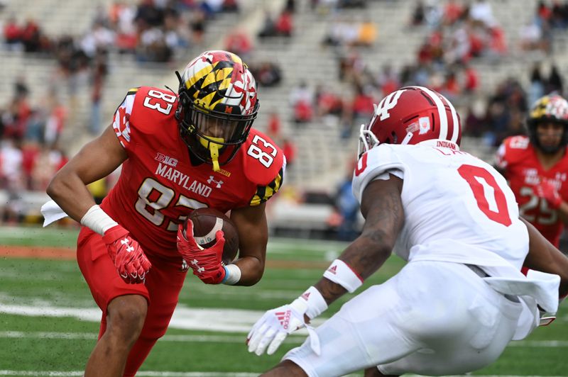 Oct 30, 2021; College Park, Maryland, USA;  Maryland Terrapins wide receiver Carlos Carriere (83) runs after the catch for a touchdown as Indiana Hoosiers quarterback Donaven McCulley (0) defends during the second half at Capital One Field at Maryland Stadium. Mandatory Credit: Tommy Gilligan-USA TODAY Sports