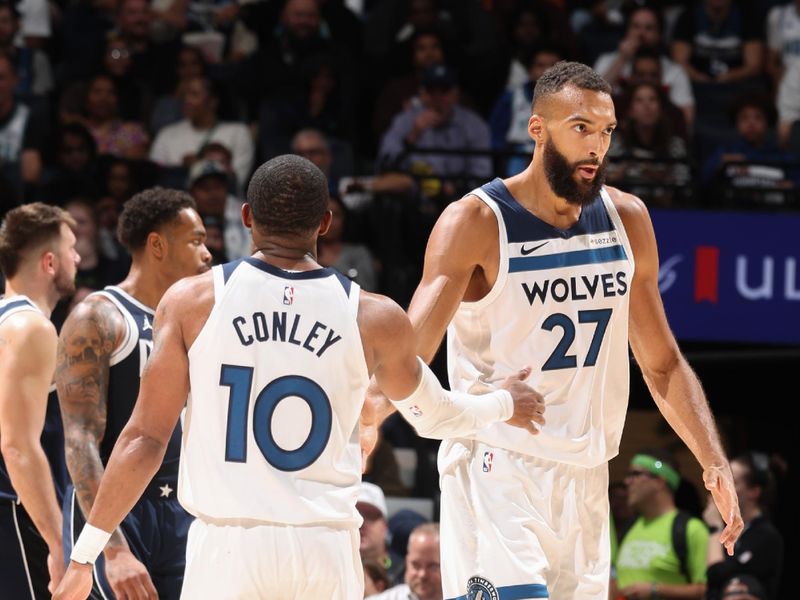 MINNEAPOLIS, MN -  OCTOBER 29: Mike Conley #10 and Rudy Gobert #27 of the Minnesota Timberwolves high five during the game against the Dallas Mavericks on October 29, 2024 at Target Center in Minneapolis, Minnesota. NOTE TO USER: User expressly acknowledges and agrees that, by downloading and or using this Photograph, user is consenting to the terms and conditions of the Getty Images License Agreement. Mandatory Copyright Notice: Copyright 2024 NBAE (Photo by David Sherman/NBAE via Getty Images)