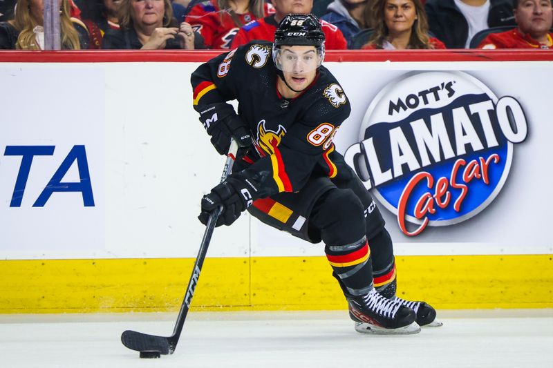 Dec 2, 2023; Calgary, Alberta, CAN; Calgary Flames left wing Andrew Mangiapane (88) skates with the puck against the Vancouver Canucks during the second period at Scotiabank Saddledome. Mandatory Credit: Sergei Belski-USA TODAY Sports