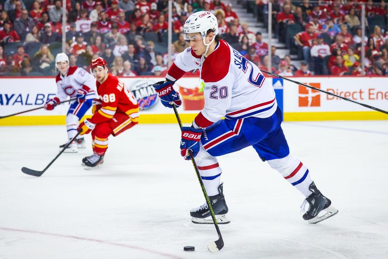 Mar 16, 2024; Calgary, Alberta, CAN; Montreal Canadiens left wing Juraj Slafkovsky (20) controls the puck against the Calgary Flames during the third period at Scotiabank Saddledome. Mandatory Credit: Sergei Belski-USA TODAY Sports