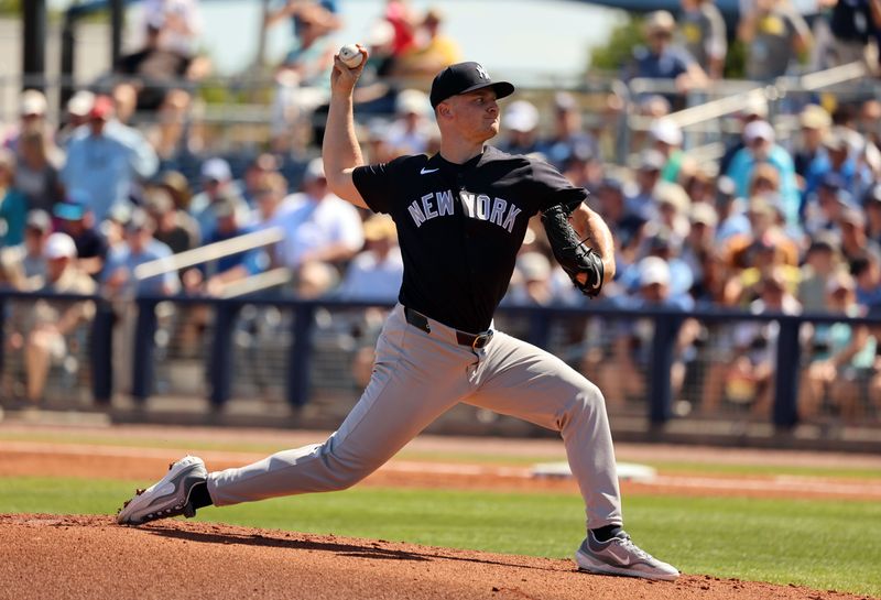 Feb 27, 2024; Port Charlotte, Florida, USA;  New York Yankees starting pitcher Clarke Schmidt (36) throws a pitch during the first inning against the Tampa Bay Rays at Charlotte Sports Park. Mandatory Credit: Kim Klement Neitzel-USA TODAY Sports