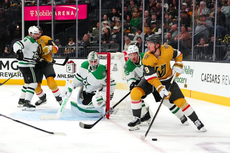 Dec 6, 2024; Las Vegas, Nevada, USA; Vegas Golden Knights center Jack Eichel (9) controls the puck in front of Dallas Stars defenseman Ilya Lyubushkin (46) as Dallas Stars goaltender Jake Oettinger (29) defends his net during the second period at T-Mobile Arena. Mandatory Credit: Stephen R. Sylvanie-Imagn Images