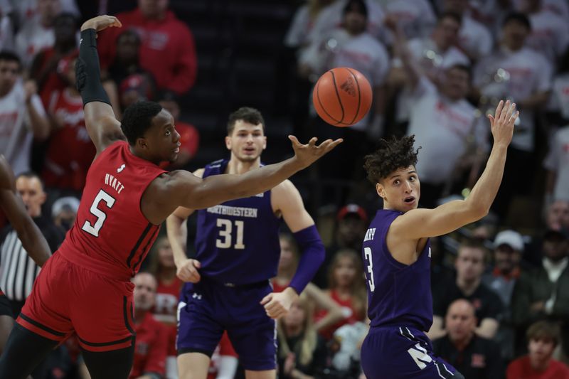 Mar 5, 2023; Piscataway, New Jersey, USA; Rutgers Scarlet Knights forward Aundre Hyatt (5) rebounds against Northwestern Wildcats guard Ty Berry (3) during the first half at Jersey Mike's Arena. Mandatory Credit: Vincent Carchietta-USA TODAY Sports