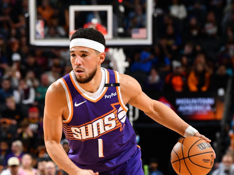 PHOENIX, AZ - NOVEMBER 30: Devin Booker #1 of the Phoenix Suns dribbles the ball during the game against the Golden State Warriors on November 30, 2024 at Footprint Center in Phoenix, Arizona. NOTE TO USER: User expressly acknowledges and agrees that, by downloading and or using this photograph, user is consenting to the terms and conditions of the Getty Images License Agreement. Mandatory Copyright Notice: Copyright 2024 NBAE (Photo by Barry Gossage/NBAE via Getty Images)