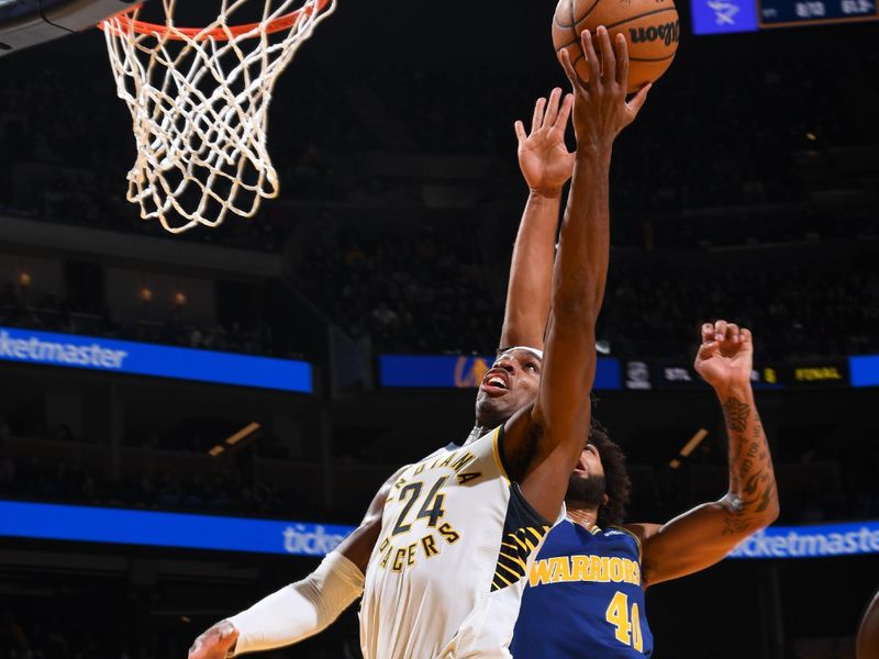 SAN FRANCISCO, CA - DECEMBER 5: Buddy Hield #24 of the Indiana Pacers drives to the basket during the game against the Golden State Warriors on December 5, 2022 at Chase Center in San Francisco, California. NOTE TO USER: User expressly acknowledges and agrees that, by downloading and or using this photograph, user is consenting to the terms and conditions of Getty Images License Agreement. Mandatory Copyright Notice: Copyright 2022 NBAE (Photo by Noah Graham/NBAE via Getty Images)