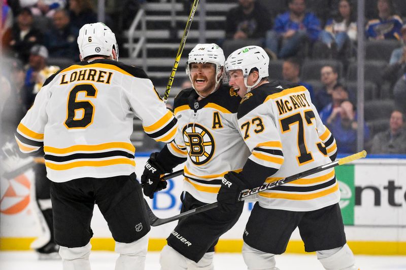 Nov 12, 2024; St. Louis, Missouri, USA;  Boston Bruins right wing David Pastrnak (88) celebrates with defenseman Charlie McAvoy (73) and defenseman Mason Lohrei (6) after scoring the game winning goal against the St. Louis Blues during the third period at Enterprise Center. Mandatory Credit: Jeff Curry-Imagn Images