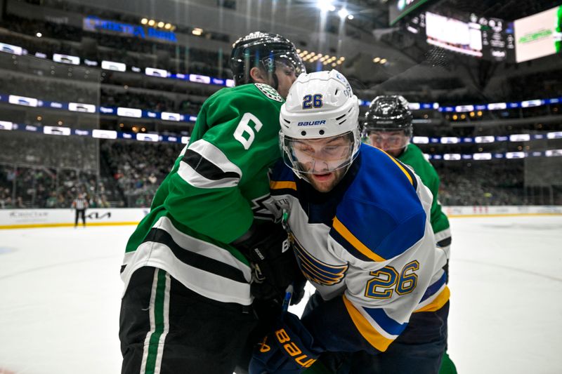 Dec 14, 2024; Dallas, Texas, USA; Dallas Stars defenseman Lian Bichsel (6) checks St. Louis Blues left wing Nathan Walker (26) during the first period at American Airlines Center. Mandatory Credit: Jerome Miron-Imagn Images