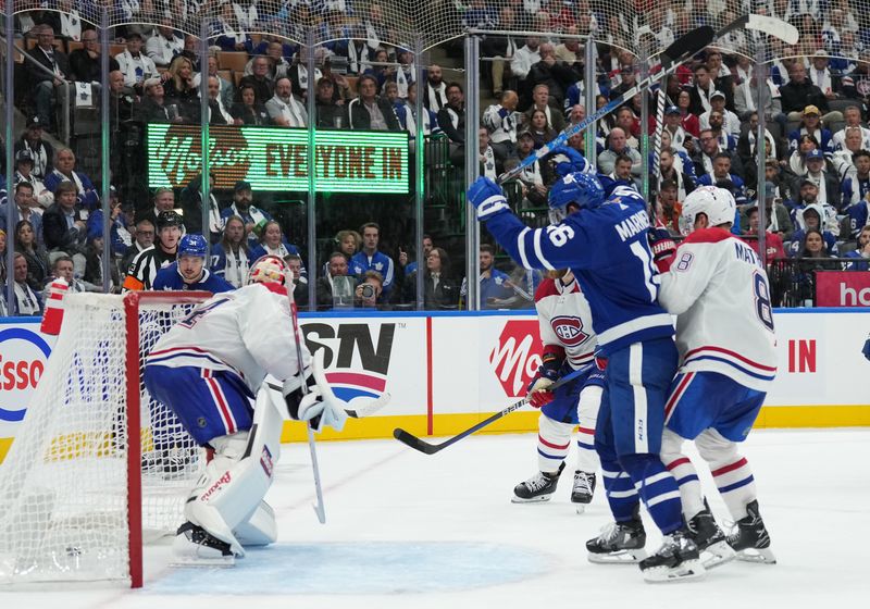 Oct 11, 2023; Toronto, Ontario, CAN; Toronto Maple Leafs center Auston Matthews (34) scores his third goal of the game against the Montreal Canadiens during the third period at Scotiabank Arena. Mandatory Credit: Nick Turchiaro-USA TODAY Sports