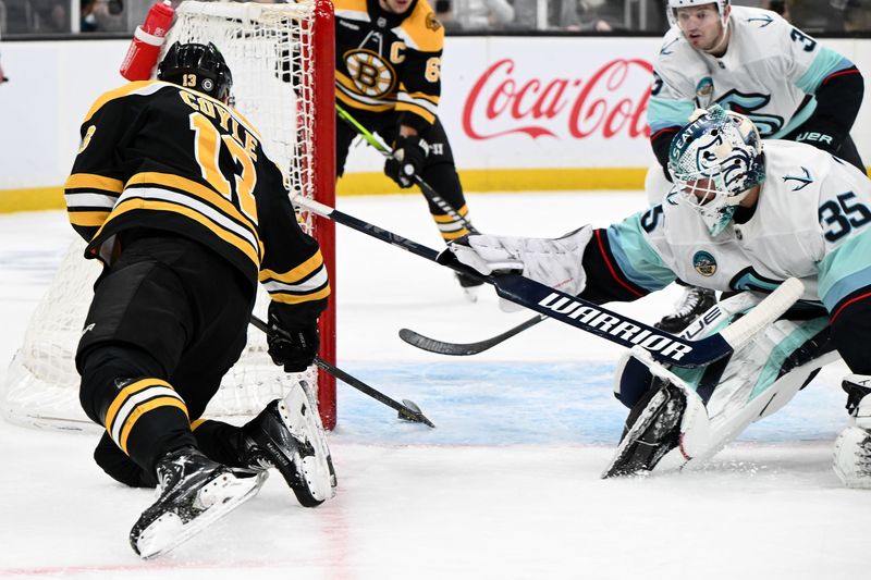 Nov 3, 2024; Boston, Massachusetts, USA; Boston Bruins center Charlie Coyle (13) scores on Seattle Kraken goaltender Joey Daccord (35) during the first period at the TD Garden. Mandatory Credit: Brian Fluharty-Imagn Images