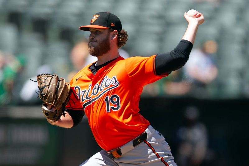 Jul 6, 2024; Oakland, California, USA; Baltimore Orioles pitcher Cole Irvin (19) delivers a pitch against the Oakland Athletics during the fourth inning at Oakland-Alameda County Coliseum. Mandatory Credit: D. Ross Cameron-USA TODAY Sports