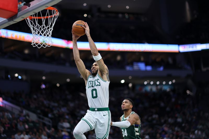 MILWAUKEE, WISCONSIN - NOVEMBER 10: Jayson Tatum #0 of the Boston Celtics dunks against the Milwaukee Bucks during the second half of a game at Fiserv Forum on November 10, 2024 in Milwaukee, Wisconsin. NOTE TO USER: User expressly acknowledges and agrees that, by downloading and or using this photograph, User is consenting to the terms and conditions of the Getty Images License Agreement. (Photo by Stacy Revere/Getty Images)