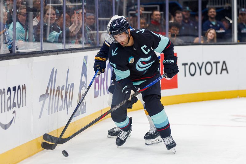 Oct 8, 2024; Seattle, Washington, USA; Seattle Kraken right wing Jordan Eberle (7) moves the puck against the St. Louis Blues during the first period at Climate Pledge Arena. Mandatory Credit: Caean Couto-Imagn Images