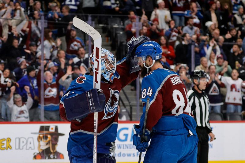 Nov 4, 2025; Denver, Colorado, USA; Colorado Avalanche goaltender Scott Wedgewood (41) celebrates with defenseman Brent Burns (84) after the game against the Tampa Bay Lightning at Ball Arena. Mandatory Credit: Isaiah J. Downing-Imagn Images