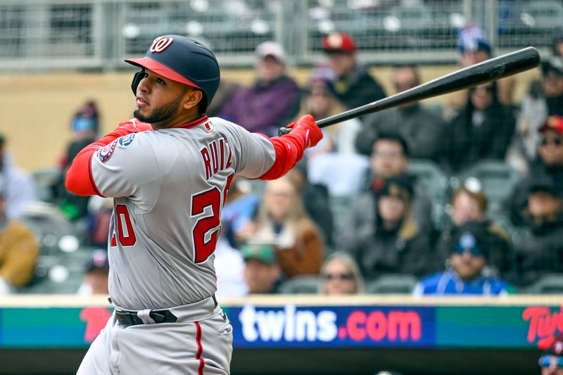 Apr 23, 2023; Minneapolis, Minnesota, USA;  Washington Nationals catcher Keibert Ruiz (20) hits an RBI double against the Minnesota Twins during the first inning at Target Field. Mandatory Credit: Nick Wosika-USA TODAY Sports