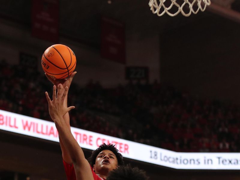 Jan 17, 2026; Lubbock, Texas, USA;  Texas Tech Red Raiders forward LeJuan Watts (3) shoots over BYU Cougars center Abdullah Ahmed (34) in the second half at United Supermarkets Arena. Mandatory Credit: Michael C. Johnson-Imagn Images