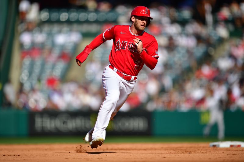 Jul 19, 2023; Anaheim, California, USA; Los Angeles Angels left fielder Taylor Ward (3) runs to third against the New York Yankees during the third inning at Angel Stadium. Mandatory Credit: Gary A. Vasquez-USA TODAY Sports