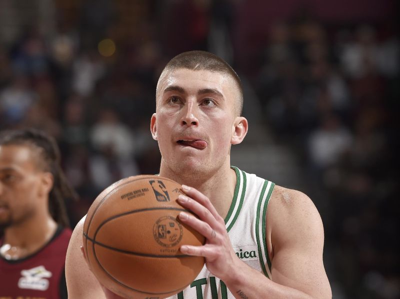 CLEVELAND, OH - DECEMBER 1: Payton Pritchard #11 of the Boston Celtics shoots a free throw during the game against the Cleveland Cavaliers on December 1, 2024 at Rocket Mortgage FieldHouse in Cleveland, Ohio. NOTE TO USER: User expressly acknowledges and agrees that, by downloading and/or using this Photograph, user is consenting to the terms and conditions of the Getty Images License Agreement. Mandatory Copyright Notice: Copyright 2024 NBAE (Photo by David Liam Kyle/NBAE via Getty Images)