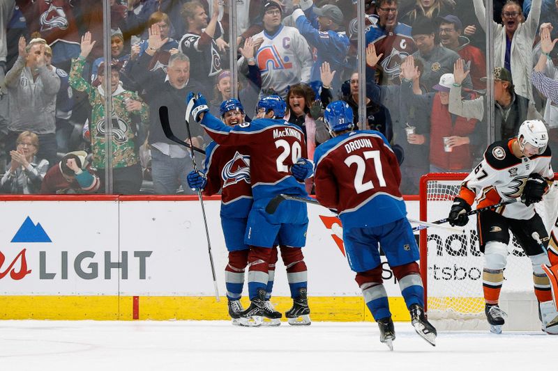 Dec 5, 2023; Denver, Colorado, USA; Colorado Avalanche right wing Logan O'Connor (25) celebrates his goal with center Nathan MacKinnon (29) and left wing Jonathan Drouin (27) in the third period against the Anaheim Ducks at Ball Arena. Mandatory Credit: Isaiah J. Downing-USA TODAY Sports