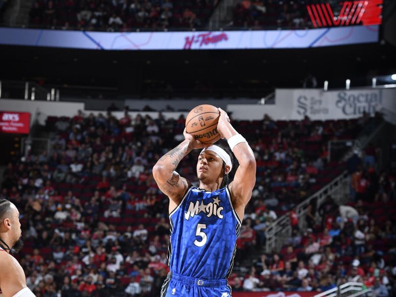 HOUSTON, TX - APRIL 9: Paolo Banchero #5 of the Orlando Magic shoots the ball during the game against the Houston Rockets on April 9, 2024 at the Toyota Center in Houston, Texas. NOTE TO USER: User expressly acknowledges and agrees that, by downloading and or using this photograph, User is consenting to the terms and conditions of the Getty Images License Agreement. Mandatory Copyright Notice: Copyright 2024 NBAE (Photo by Logan Riely/NBAE via Getty Images)