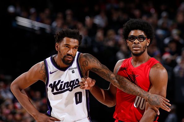 PORTLAND, OR - DECEMBER 26: Malik Monk #0 of the Sacramento Kings and Scoot Henderson #00 of the Portland Trail Blazers look on during the game on December 26, 2023 at the Moda Center Arena in Portland, Oregon. NOTE TO USER: User expressly acknowledges and agrees that, by downloading and or using this photograph, user is consenting to the terms and conditions of the Getty Images License Agreement. Mandatory Copyright Notice: Copyright 2023 NBAE (Photo by Cameron Browne/NBAE via Getty Images)