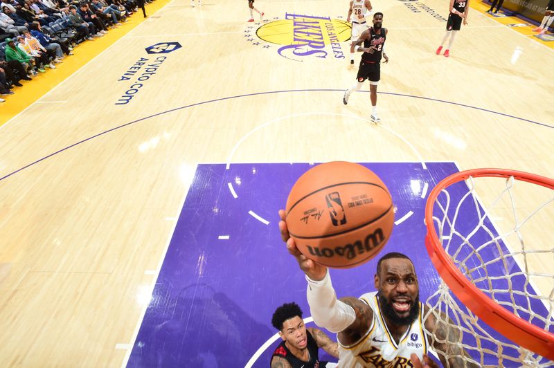 LOS ANGELES, CA - JANUARY 21:  LeBron James #23 of the Los Angeles Lakers goes to the basket during the game on January 21, 2024 at Crypto.Com Arena in Los Angeles, California. NOTE TO USER: User expressly acknowledges and agrees that, by downloading and/or using this Photograph, user is consenting to the terms and conditions of the Getty Images License Agreement. Mandatory Copyright Notice: Copyright 2024 NBAE (Photo by Juan Ocampo/NBAE via Getty Images)