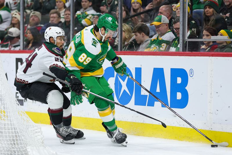 Jan 13, 2024; Saint Paul, Minnesota, USA; Minnesota Wild center Frederick Gaudreau (89) skates with the puck alongside Arizona Coyotes defenseman Matt Dumba (24)  during the third period at Xcel Energy Center. Mandatory Credit: Matt Krohn-USA TODAY Sports
