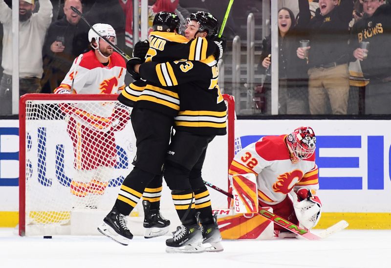 Nov 7, 2024; Boston, Massachusetts, USA;  Boston Bruins left wing Brad Marchand (63) and defenseman Charlie McAvoy (73) react after defeating the Calgary Flames in overtime at TD Garden. Mandatory Credit: Bob DeChiara-Imagn Images