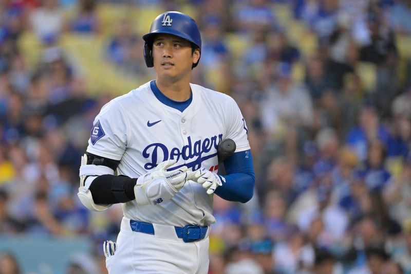 Jul 19, 2024; Los Angeles, California, USA;  Los Angeles Dodgers designated hitter Shohei Ohtani (17) walks back to the dugout after striking out in the first inning against the Boston Red Sox at Dodger Stadium. Mandatory Credit: Jayne Kamin-Oncea-USA TODAY Sports