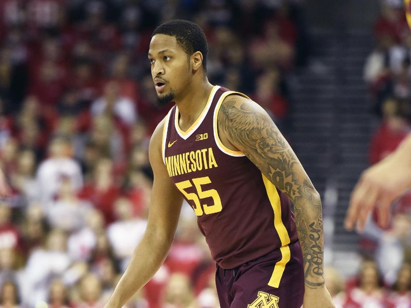 Jan 3, 2023; Madison, Wisconsin, USA; Minnesota Golden Gophers guard Ta'lon Cooper (55) dribbles the ball against the Wisconsin Badgers during the first half at the Kohl Center. Mandatory Credit: Kayla Wolf-USA TODAY Sports