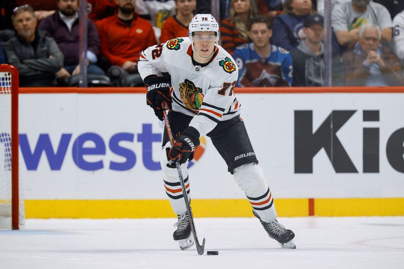 Oct 28, 2024; Denver, Colorado, USA; Chicago Blackhawks defenseman Alex Vlasic (72) controls the puck in the third period against the Colorado Avalanche at Ball Arena. Mandatory Credit: Isaiah J. Downing-Imagn Images