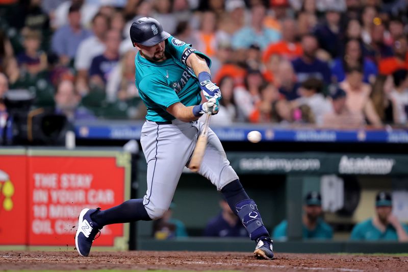 May 4, 2024; Houston, Texas, USA; Seattle Mariners catcher Cal Raleigh (29) hits a two-run home run to left field against the Houston Astros during the sixth inning at Minute Maid Park. Mandatory Credit: Erik Williams-USA TODAY Sports