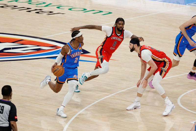 OKLAHOMA CITY, OK - APRIL 24: Shai Gilgeous-Alexander #2 of the Oklahoma City Thunder dribbles the ball during the game against the New Orleans Pelicans during Round 1 Game 2 of the 2024 NBA Playoffs on April 24, 2024 at Paycom Arena in Oklahoma City, Oklahoma. NOTE TO USER: User expressly acknowledges and agrees that, by downloading and or using this photograph, User is consenting to the terms and conditions of the Getty Images License Agreement. Mandatory Copyright Notice: Copyright 2024 NBAE (Photo by Martin McGrew/NBAE via Getty Images)