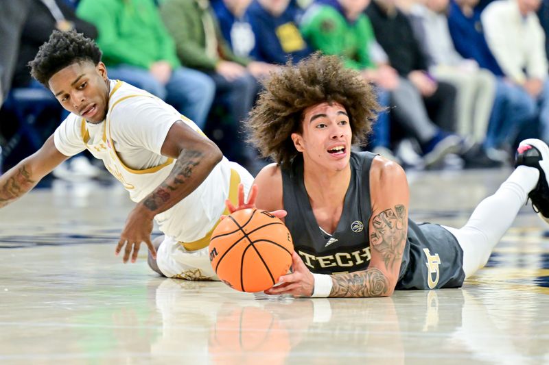 Jan 28, 2025; South Bend, Indiana, USA; Notre Dame Fighting Irish guard Markus Burton (3) and Georgia Tech Yellow Jackets guard Naithan George (1) attempt to get possession of the ball in the first half at the Purcell Pavilion. Mandatory Credit: Matt Cashore-Imagn Images