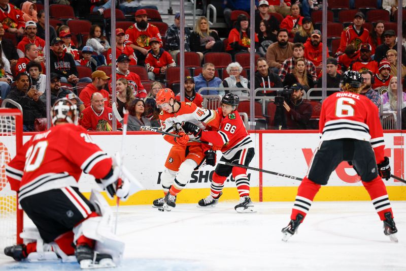Oct 19, 2025; Chicago, Illinois, USA; Anaheim Ducks right wing Beckett Sennecke (45) battles for the puck with Chicago Blackhawks center Teuvo Teravainen (86) during the first period at United Center. Mandatory Credit: Kamil Krzaczynski-Imagn Images