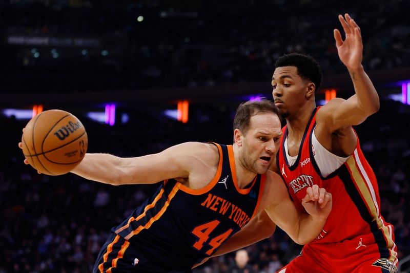 NEW YORK, NEW YORK - FEBRUARY 27: Bojan Bogdanovic #44 of the New York Knicks dribbles against Trey Murphy III #25 of the New Orleans Pelicans during the first half at Madison Square Garden on February 27, 2024 in New York City. NOTE TO USER: User expressly acknowledges and agrees that, by downloading and or using this photograph, User is consenting to the terms and conditions of the Getty Images License Agreement. (Photo by Sarah Stier/Getty Images)