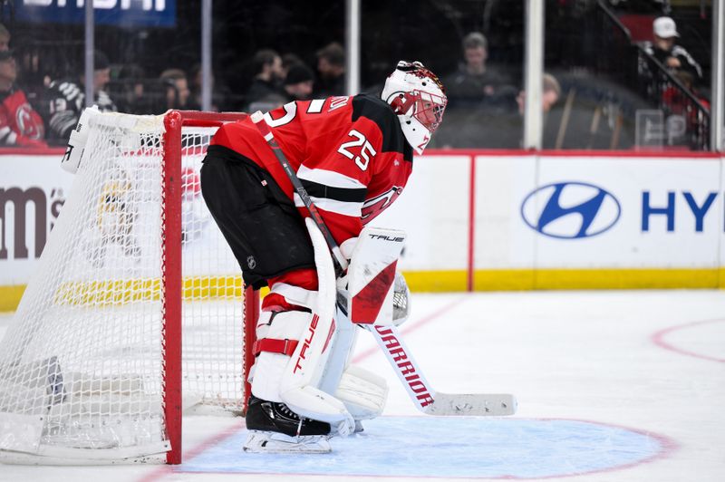 Dec 14, 2025; Newark, New Jersey, USA; New Jersey Devils goaltender Jacob Markstrom (25) tends net against the Vancouver Canucks during the third period at Prudential Center. Mandatory Credit: John Jones-Imagn Images