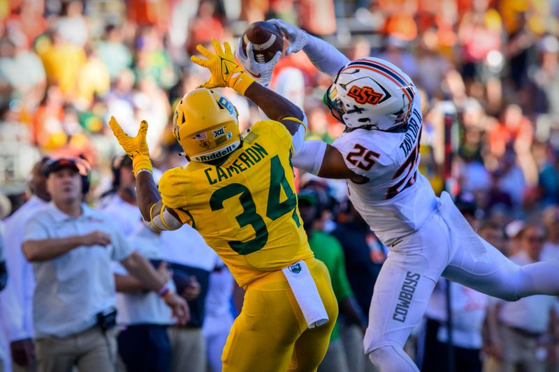 Oct 1, 2022; Waco, Texas, USA; Oklahoma State Cowboys safety Jason Taylor II (25) intercepts a pass intended for Baylor Bears wide receiver Josh Cameron (34) during the second half at McLane Stadium. Mandatory Credit: Jerome Miron-USA TODAY Sports