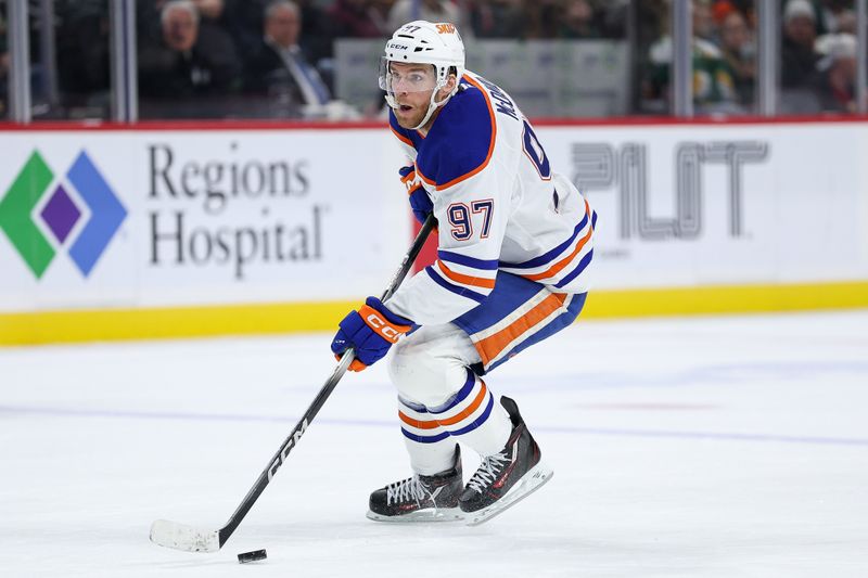 Dec 20, 2025; Saint Paul, Minnesota, USA; Edmonton Oilers center Connor McDavid (97) skates with the puck against the Minnesota Wild during the third period at Grand Casino Arena. Mandatory Credit: Matt Krohn-Imagn Images