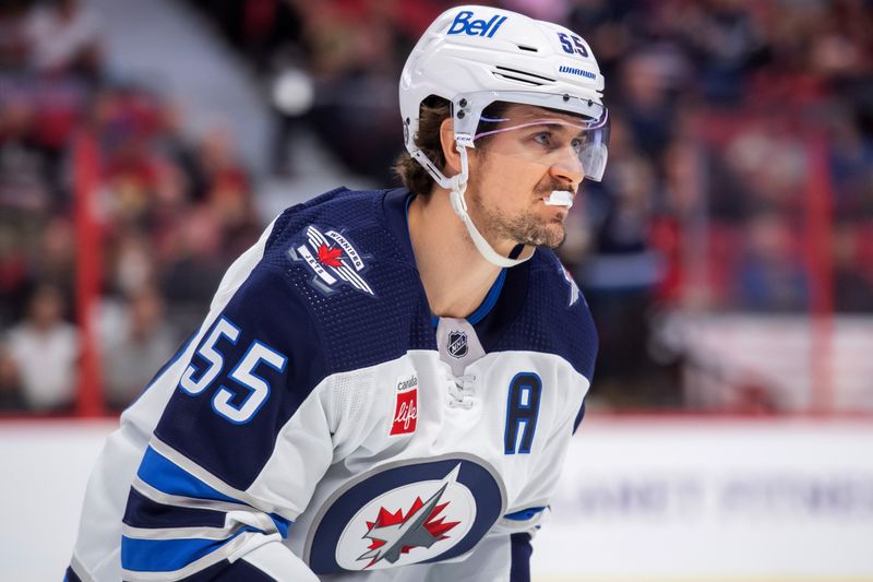 Jan 21, 2023; Ottawa, Ontario, CAN; Winnipeg Jets center Mark Scheifele (55) skates to the bench after scoring a goal in the second period against the Ottawa Senators at the Canadian Tire Centre. Mandatory Credit: Marc DesRosiers-USA TODAY Sports