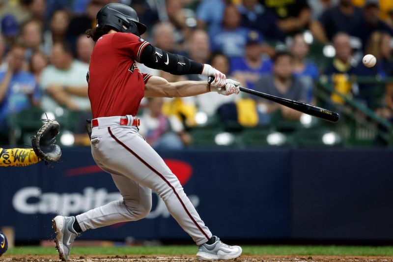 Oct 4, 2023; Milwaukee, Wisconsin, USA; Arizona Diamondbacks center fielder Alek Thomas (5) hits a home run in the fifth inning against the Milwaukee Brewers during game two of the Wildcard series for the 2023 MLB playoffs at American Family Field. Mandatory Credit: Kamil Krzaczynski-USA TODAY Sports