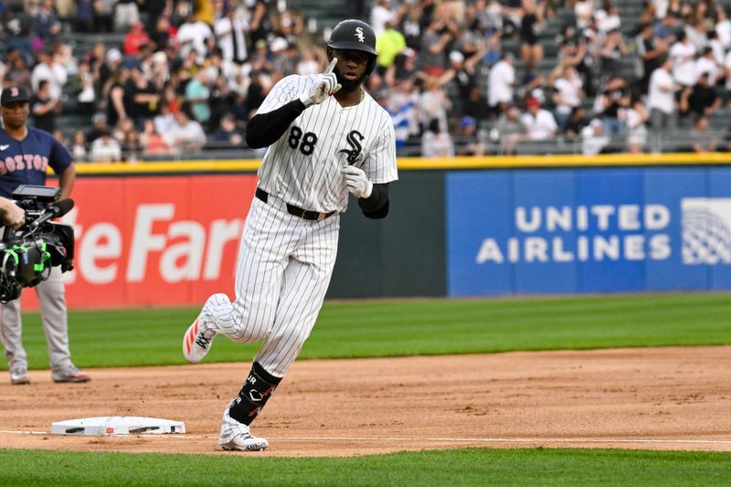 Jun 7, 2024; Chicago, Illinois, USA;  Chicago White Sox outfielder Luis Robert Jr. (88) points after he hits a home run against the Boston Red Sox during the first inning at Guaranteed Rate Field. Mandatory Credit: Matt Marton-USA TODAY Sports