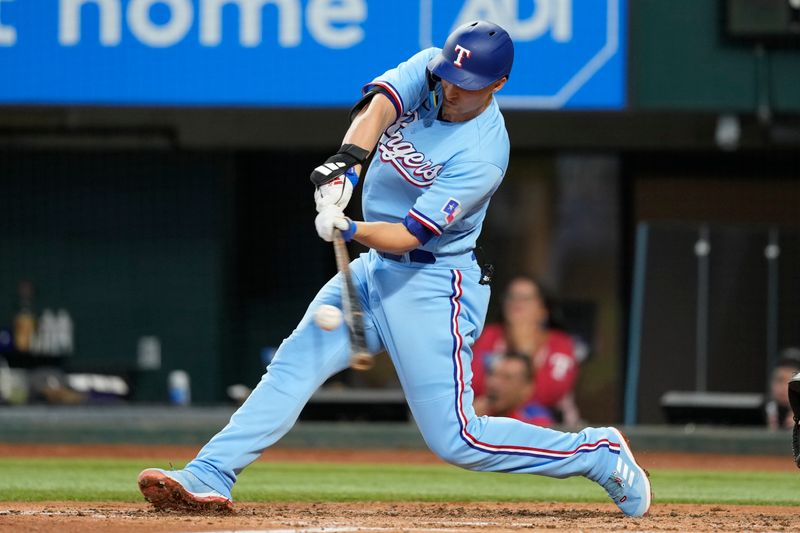 Aug 20, 2023; Arlington, Texas, USA; Texas Rangers shortstop Corey Seager (5) connects for a solo home run against the Milwaukee Brewers during the third inning at Globe Life Field. Mandatory Credit: Jim Cowsert-USA TODAY Sports