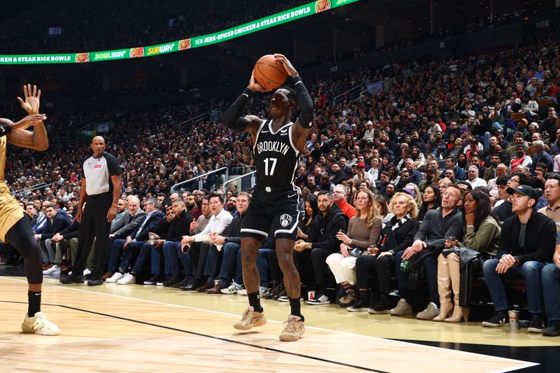 TORONTO, CANADA - FEBRUARY 22: Dennis Schroder #17 of the Brooklyn Nets shoots a three point basket during the game against the Toronto Raptors on February 22, 2024 at the Scotiabank Arena in Toronto, Ontario, Canada.  NOTE TO USER: User expressly acknowledges and agrees that, by downloading and or using this Photograph, user is consenting to the terms and conditions of the Getty Images License Agreement.  Mandatory Copyright Notice: Copyright 2024 NBAE (Photo by Vaughn Ridley/NBAE via Getty Images)