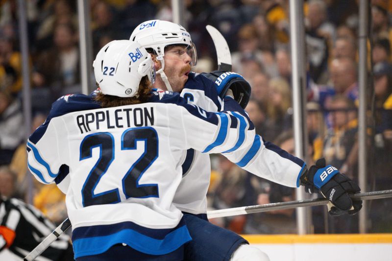 Nov 23, 2024; Nashville, Tennessee, USA;  Winnipeg Jets center Adam Lowry (17) celebrates his goal with center Mason Appleton (22) against the Nashville Predators during the second period at Bridgestone Arena. Mandatory Credit: Steve Roberts-Imagn Images