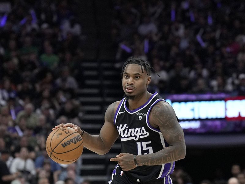 SACRAMENTO, CALIFORNIA - APRIL 11: Davion Mitchell #15 of the Sacramento Kings dribbles the ball against the New Orleans Pelicans during the second half of an NBA basketball game at Golden 1 Center on April 11, 2024 in Sacramento, California. NOTE TO USER: User expressly acknowledges and agrees that, by downloading and or using this photograph, User is consenting to the terms and conditions of the Getty Images License Agreement. (Photo by Thearon W. Henderson/Getty Images)