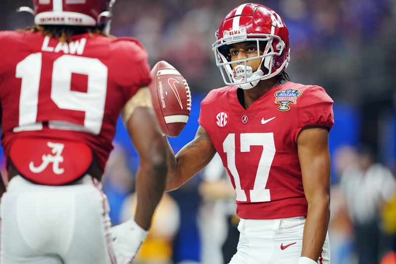 Dec 31, 2022; New Orleans, LA, USA; Alabama Crimson Tide wide receiver Isaiah Bond (17) celebrates his touchdown scored against the Kansas State Wildcats with wide receiver Kendrick Law (19) during the first half in the 2022 Sugar Bowl at Caesars Superdome. Mandatory Credit: Andrew Wevers-USA TODAY Sports