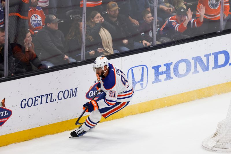 Feb 9, 2024; Anaheim, California, USA; Edmonton Oilers left wing Evander Kane (91) celebrates after scoring a goal during the third period of a game against the Anaheim Ducks at Honda Center. Mandatory Credit: Jessica Alcheh-USA TODAY Sports