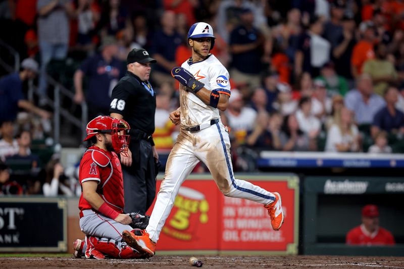 Sep 1, 2025; Houston, Texas, USA; Houston Astros shortstop Jeremy Pena (3) crosses home plate to score a run against the Los Angeles Angels during the third inning at Daikin Park. Mandatory Credit: Erik Williams-Imagn Images