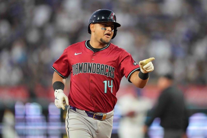 Jul 3, 2024; Los Angeles, California, USA; Arizona Diamondbacks catcher Gabriel Moreno (14) gestures after hitting a two-run home run in the third inning against the Los Angeles Dodgers at Dodger Stadium. Mandatory Credit: Kirby Lee-USA TODAY Sports