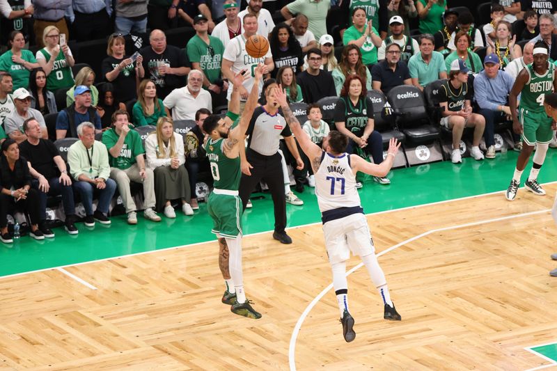 BOSTON, MA - JUNE 17: Jayson Tatum #0 of the Boston Celtics shoots the ball during the game against the Dallas Mavericks during Game 5 of the 2024 NBA Finals on June 17, 2024 at TD Garden in Boston, Massachusetts. NOTE TO USER: User expressly acknowledges and agrees that, by downloading and or using this photograph, User is consenting to the terms and conditions of the Getty Images License Agreement. Mandatory Copyright Notice: Copyright 2024 NBAE  (Photo by Joe Murphy/NBAE via Getty Images)